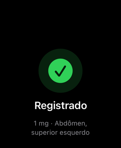 Dial no Apple Watch confirmando uma dose registrada com um visto, mostrando a quantidade e o local de injeção