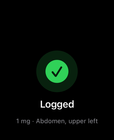 Dial on Apple Watch confirming a logged dose with a checkmark, showing the amount and injection site